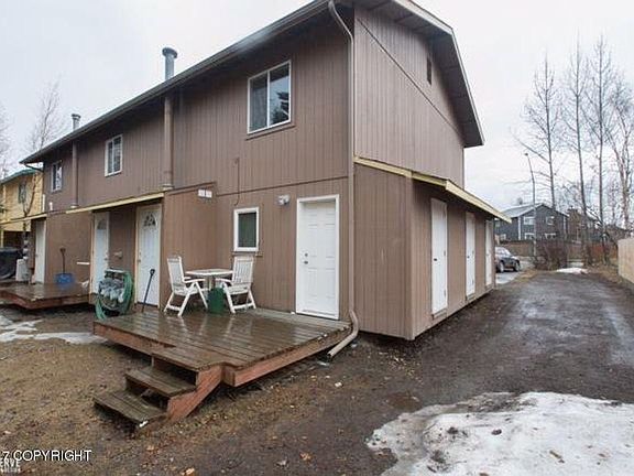 Private storage unit on the side of the building and rear vi