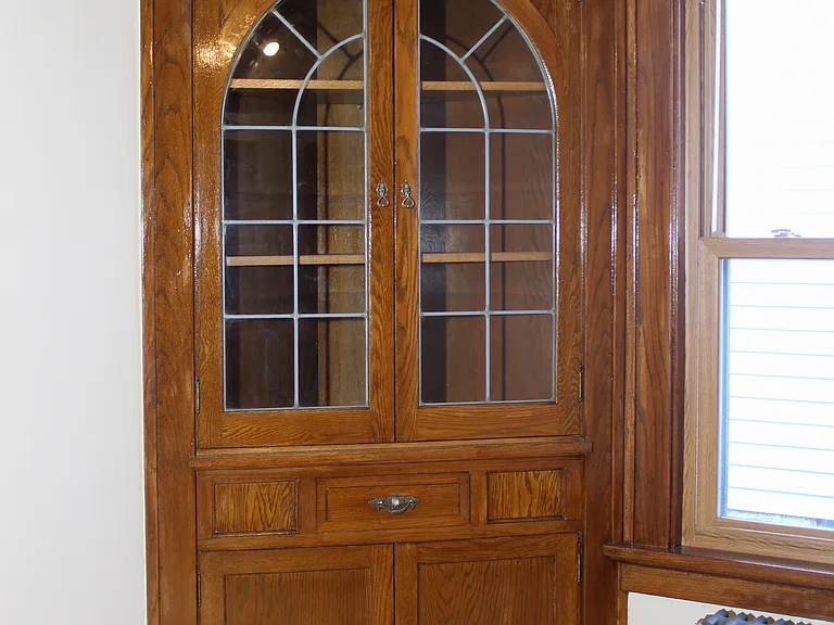 Dining room with good windows, built in cabinets, wood floors, and refinished woodwork.