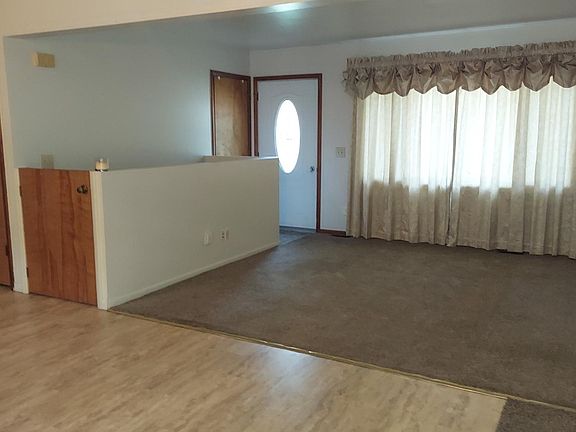 Livingroom; coat closet; half door to stairs and sm. pantry closet.