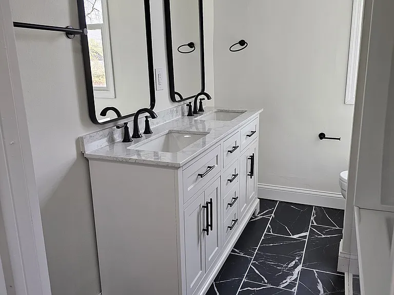 Brand new state-of-the-art bathroom, with brand new bathtub, separate mirrors and sink for his and her, and toilet.