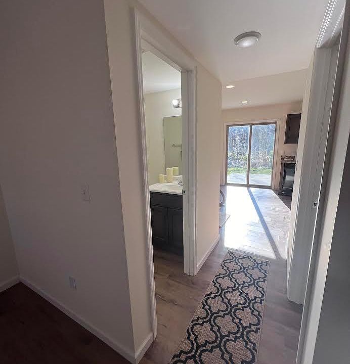 continue to walk to either your half bathroom on left, or full utility room with washer and dryer hookup
