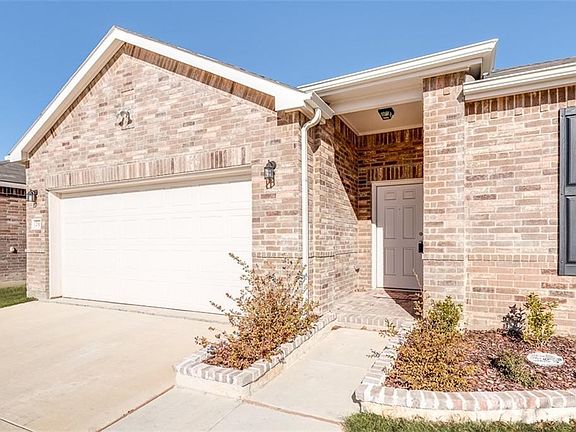 2 car garage with opener. Exterior lighting. Covered patio. Bricked plant beds.