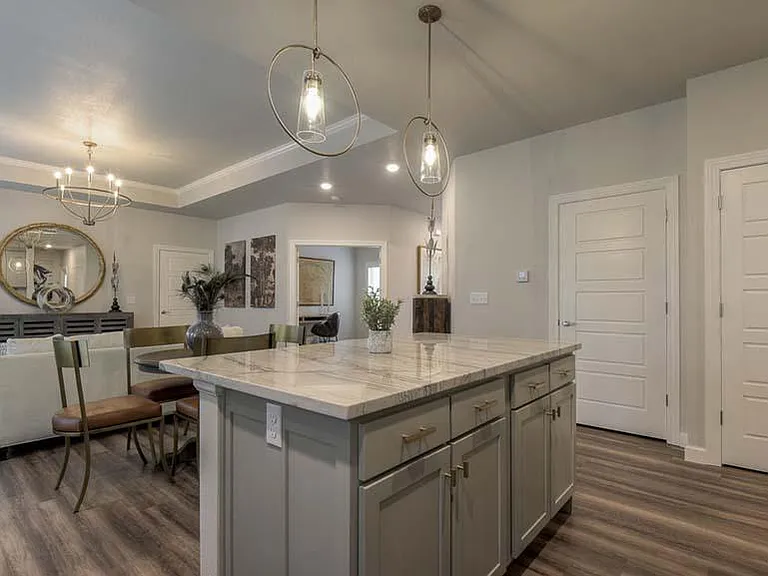 The Cardiff- Kitchen Looking Out to Dining Area, Great Room/Living Area and 3rd Transitional Bedroom w/Glass Front French Doors That Could Be Used As An Office or Another Living Area.