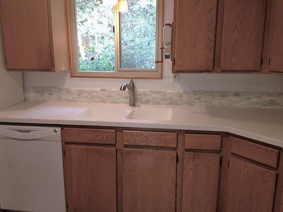 New kitchen counter tops and tile backsplash