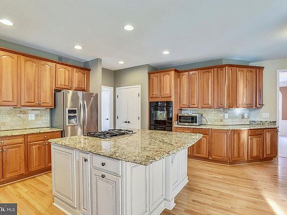 The kitchen has a extra large island.