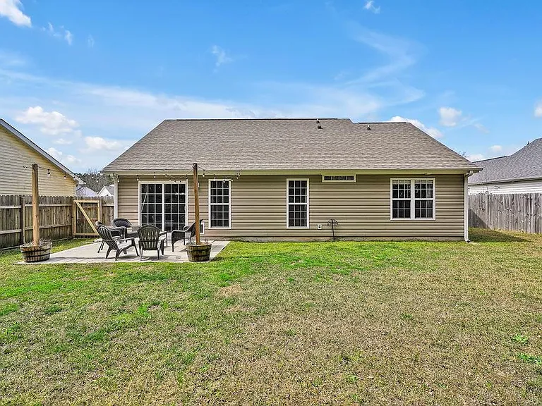 Privacy fenced in backyard and patio