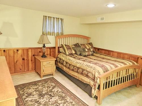 Bedroom area with queen sized bed. Includes sheets and bed covering