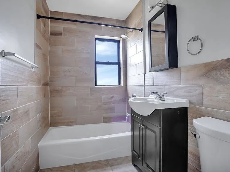 Full Bathroom with window and tub/shower