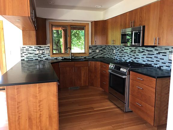 Kitchen with gas range/electric oven, dishwasher, view