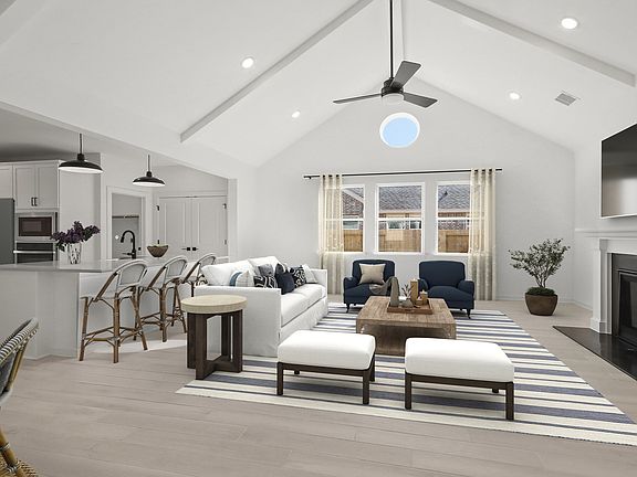 Great room with vaulted ceiling with fireplace