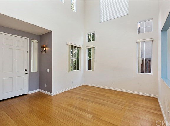 LIVING ROOM AND FRONT ENTRY.  HIGH CEILINGS