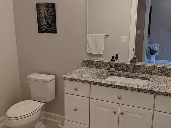 Main level powder room off of the garage