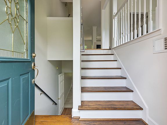 When you enter the home, you can steop up to the main living level (dining, kitchen, half bath, living room, and huge back deck), or head down to the huge bonus room featuring its own powder room and private back patio!