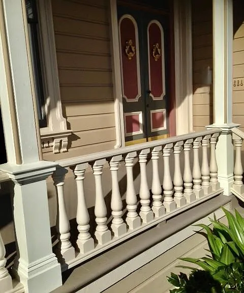 Classic mahogany railing on front porch.