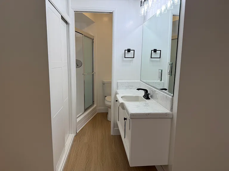 Primary Bathroom with Tiled Counter and Walk In Shower