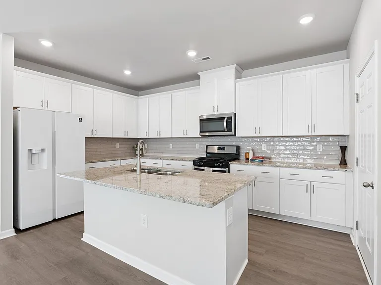 Beautiful kitchen with modern appliances and open layout perfect for a family