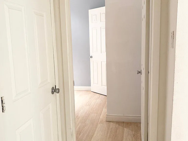 Hall Way Leading to the Bathroom and Bedroom