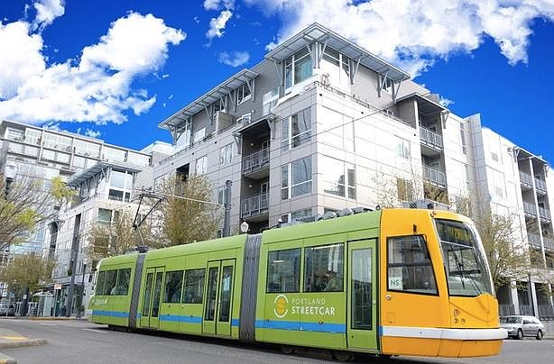 Streetcar passes in front of Lexis on NW 10th