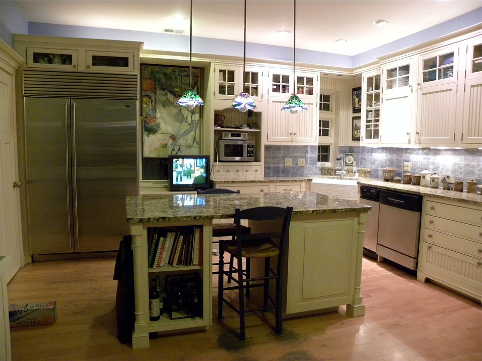 Custom kitchen with stainless appliances & Woodmode cabinets