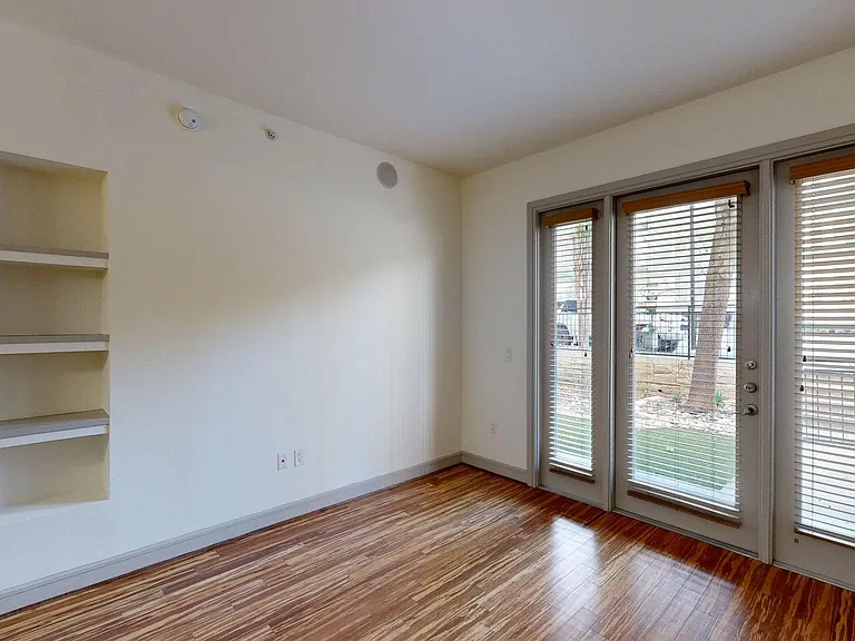 Apartment Living Room with Wood Style Flooring.