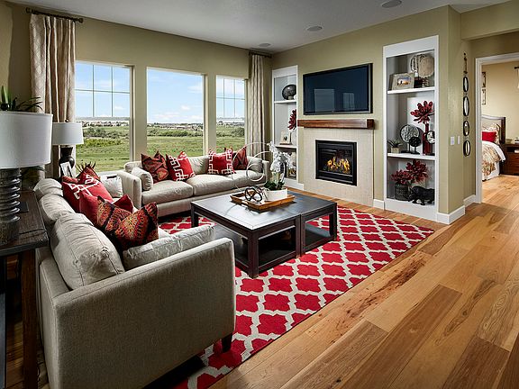 The great room is bright and airy with walls of windows.