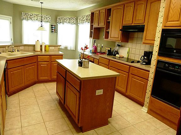 The Island is a perfect place for meal preparation and has a sold surface counter top.