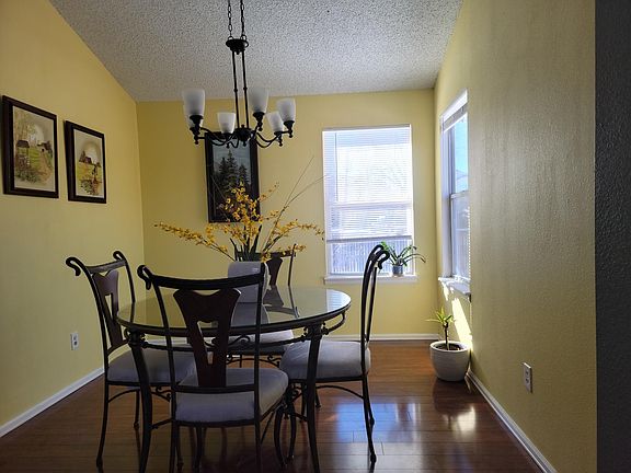 Dining room has a dog door leading into the dog run area. Great views of the backyard!