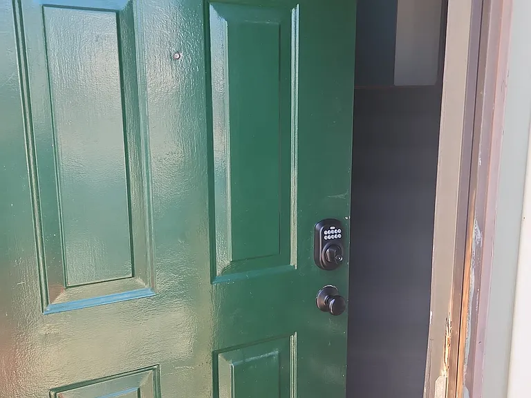 Door to the house with coded lock