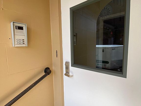 Security system with individual unit call buttons and voice verification.