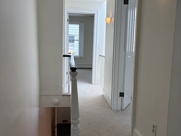Second floor hallway with brand new carpet. Linen closet available in hallway.