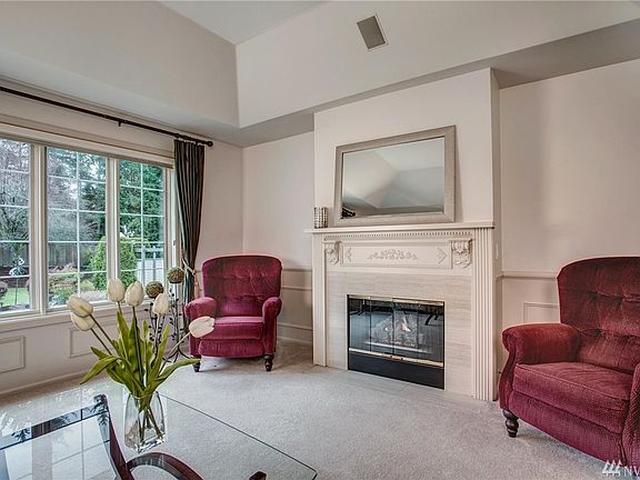 This large picture window not only lets in lovely natural light but looks out over the restful waterfall.