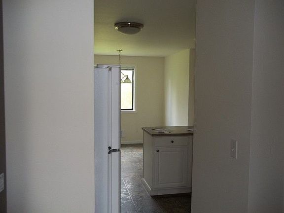 From entry, kitchen ahead and hallway to right