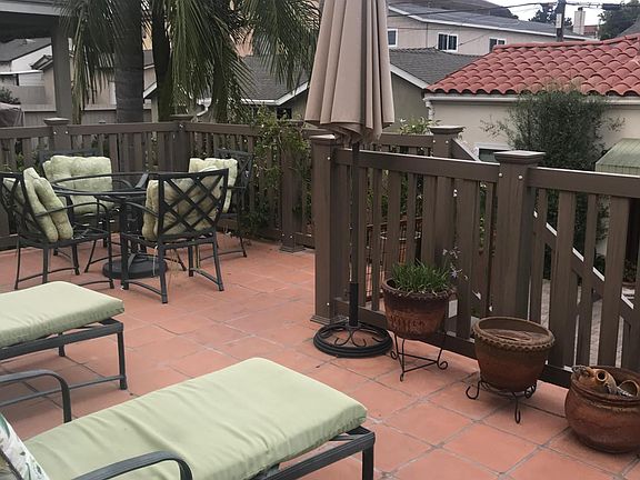 Backyard deck off of 2 bedrooms with sliding doors.