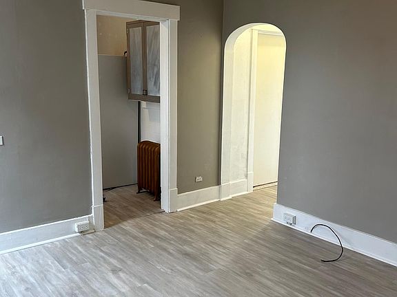 Living Room leads to Kitchen and Hallway