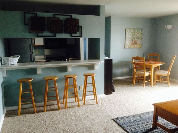 kitchen bar includes 4 Tiger Paw stools