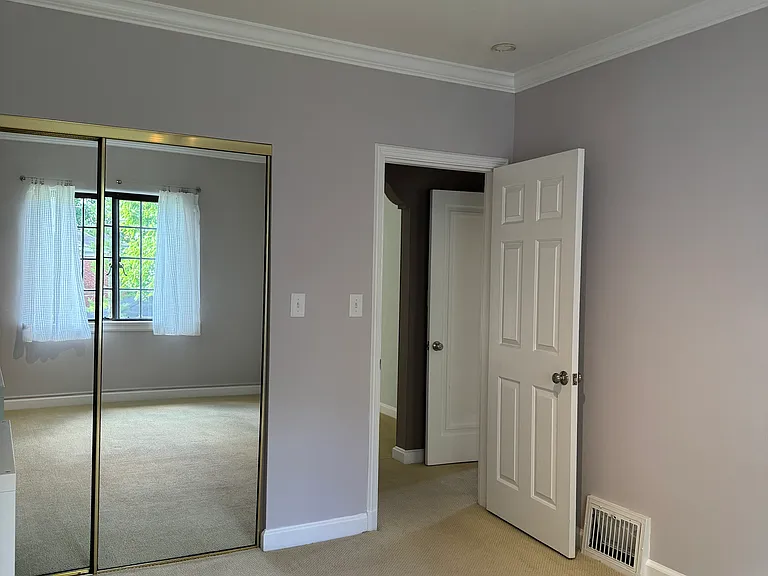 Bdrm #1 with view of closet and hallway.
