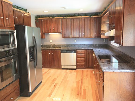 Kitchen with cherry cabinets