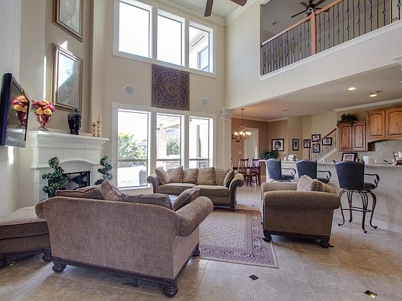 beautiful fireplace makes a dramatic focal point in this com