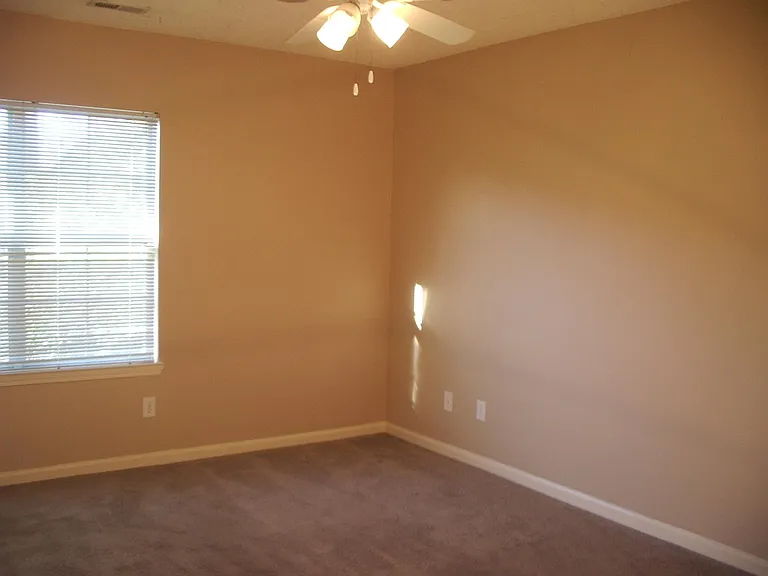 Primary bedroom with ceiling fan; Walkin closet and full bath.