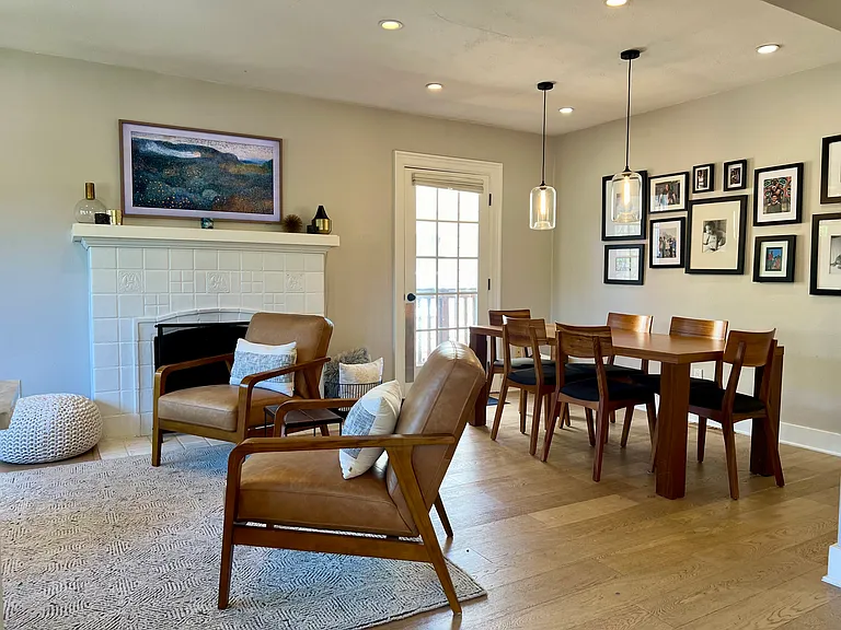 Natural gas fireplace, dining area and access to the back yard space.