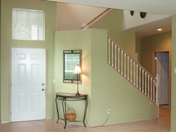 Beautiful entryway featuring staircase and view of upstairs.