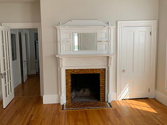 Decorative fireplace in parlor room.