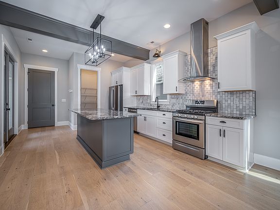 Spacious Kitchen with Gas Stove and Full-Sized Pantry