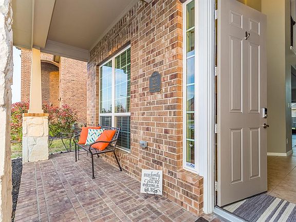 As you walk up, take a moment and imagine yourself relaxing on the fully bricked covered front porch!