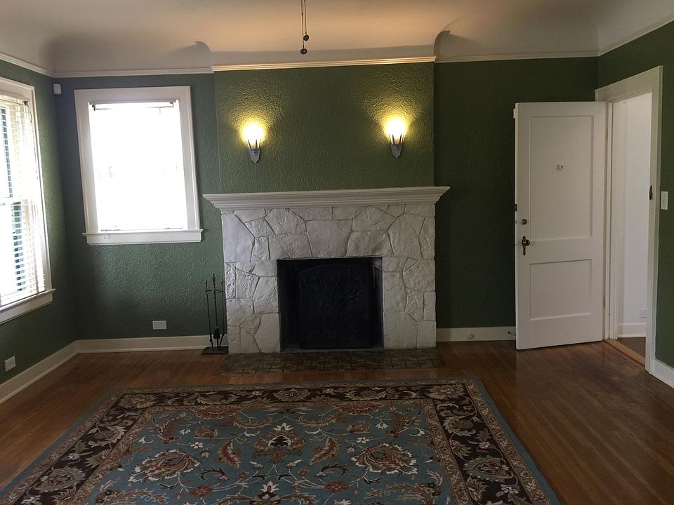 fireplace with sconces in living room