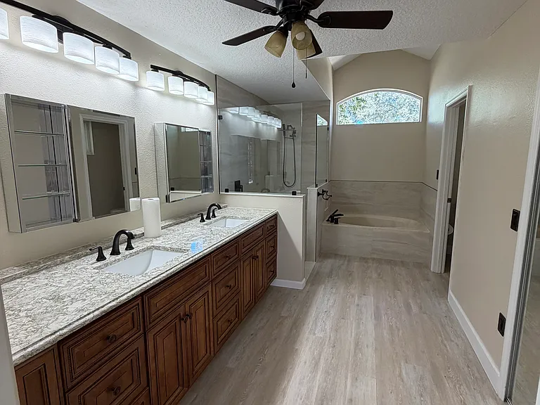 en-suite primary bath with large walk-in closet