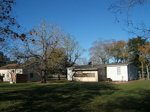 REAR VIEW OF THE HOME AND METAL BLD