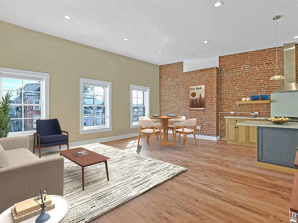 Virtually staged living, dining and kitchen areas.