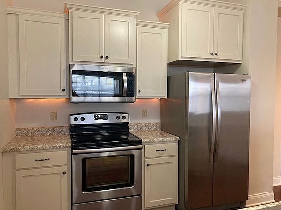 Cabinet details, stove and fridge