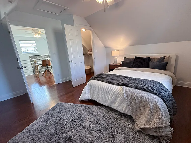 Bedroom with queen-size bed, and spacious closet